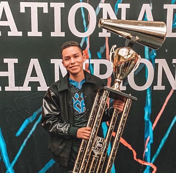 Andy Simon from cheer athletics sabres and Andy Simon cheerleading routines YouTube channel