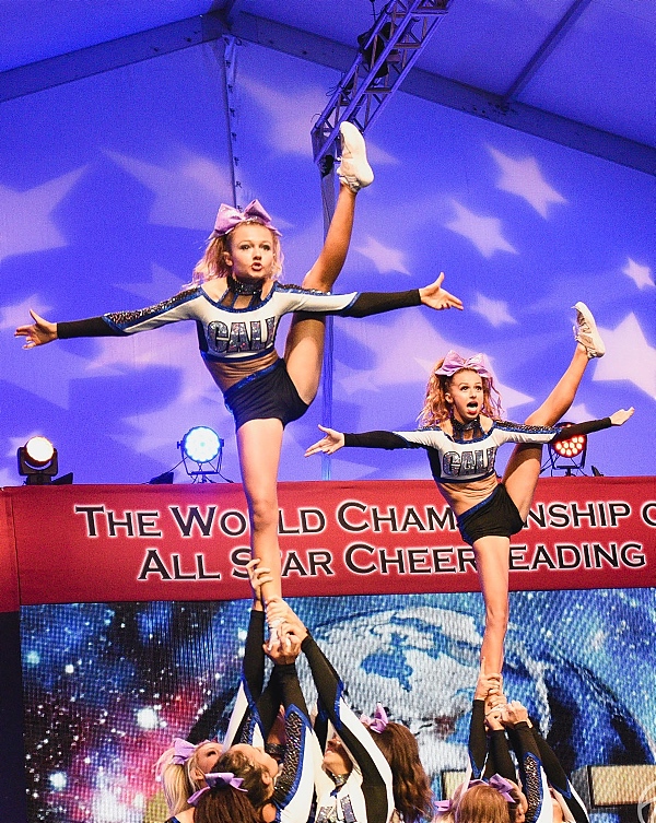 The California All Stars Sparkle at The Cheerleading Worlds 2017, flyers doing a "free stretch" body position