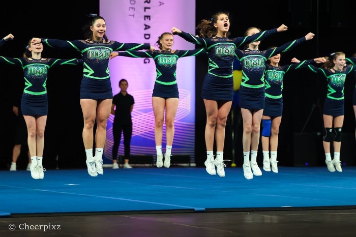 cheerleading T jump done by united movement cheer (Sweden)