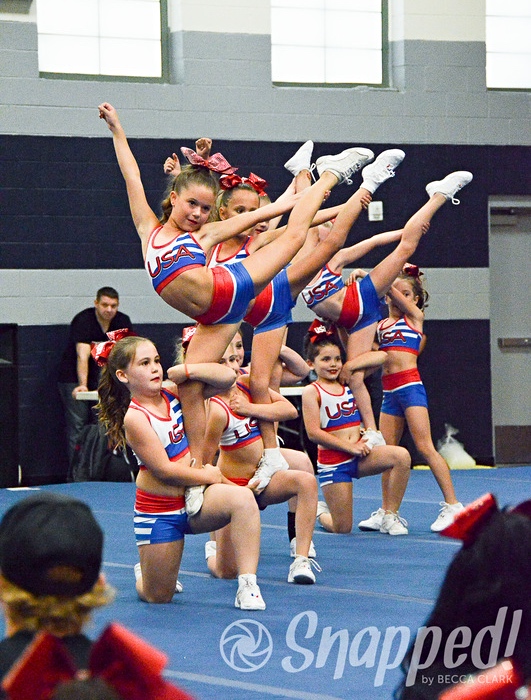 USA Starz cheerleading showcase team performing a cheer stunt